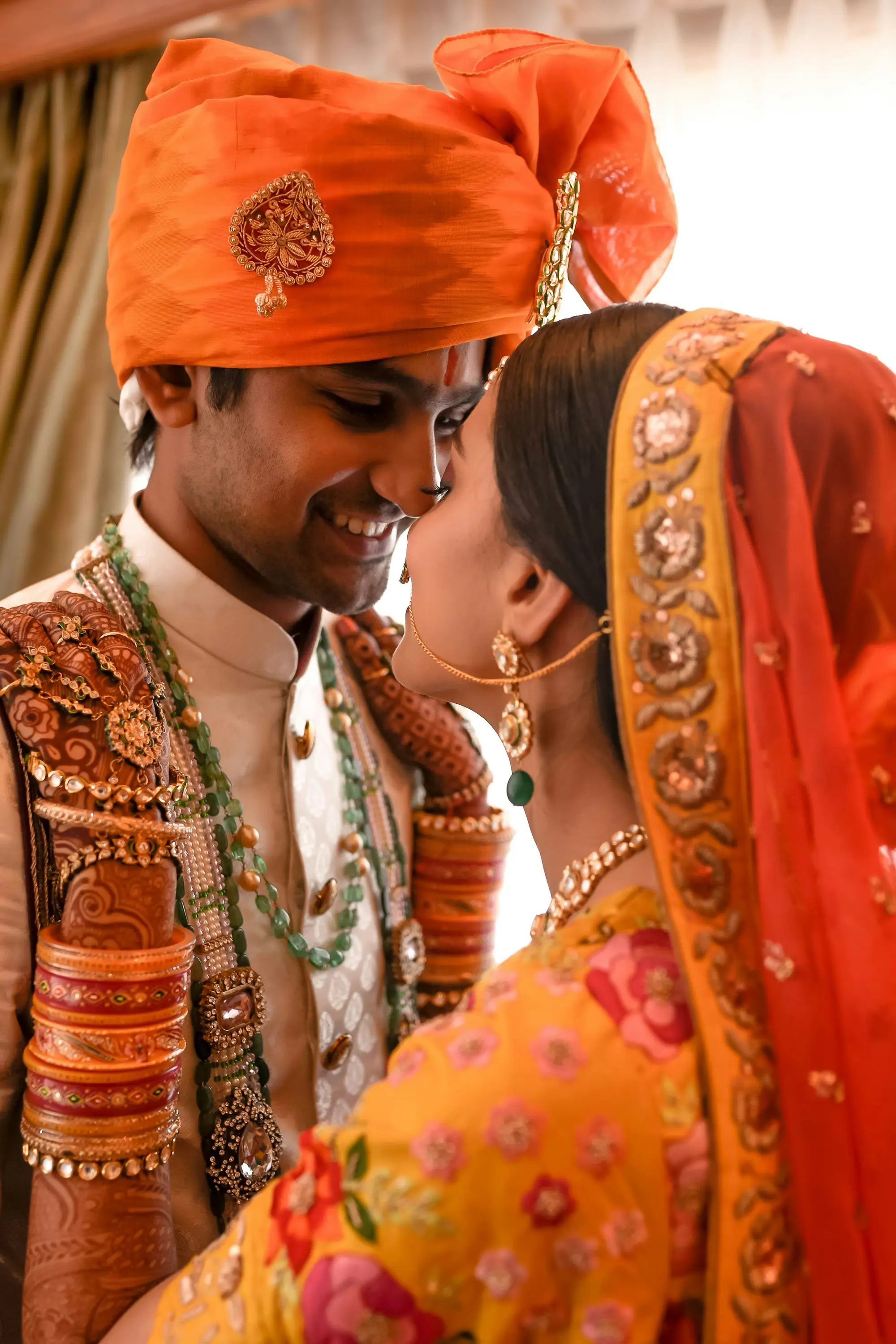 Indian bride and groom sharing a joyful moment